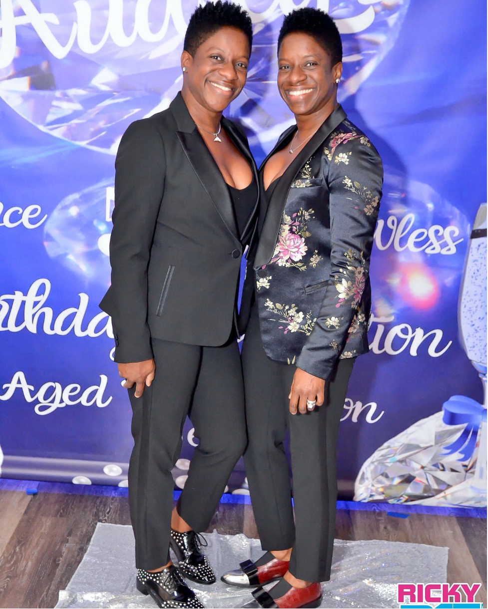 Image of twins smiling at an event