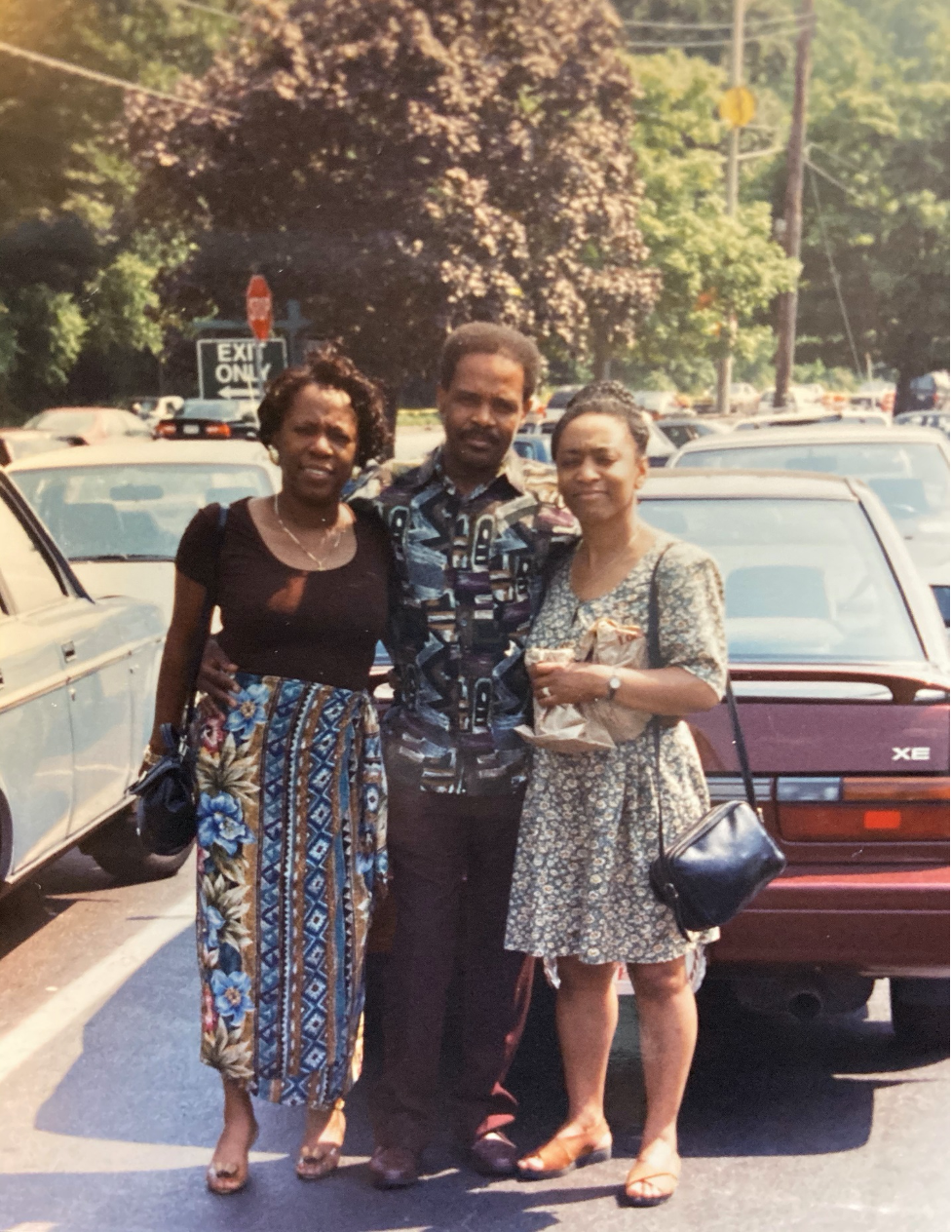 Old photo of a man with two women